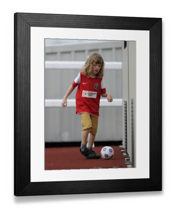 Framed Print : Young Fan's Thrill at FA WSL Match: BAWFC vs Arsenal Ladies