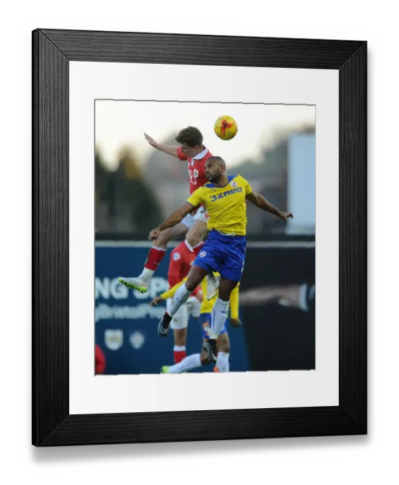 Framed Print : Bristol City vs Crawley Town: Intense Aerial Battle Between Joe Bryan and Lanre Oyebanjo Framed Print : Bristol City vs Crawley Town: Intense Aerial Battle Between Joe Bryan and Lanre Oyebanjo