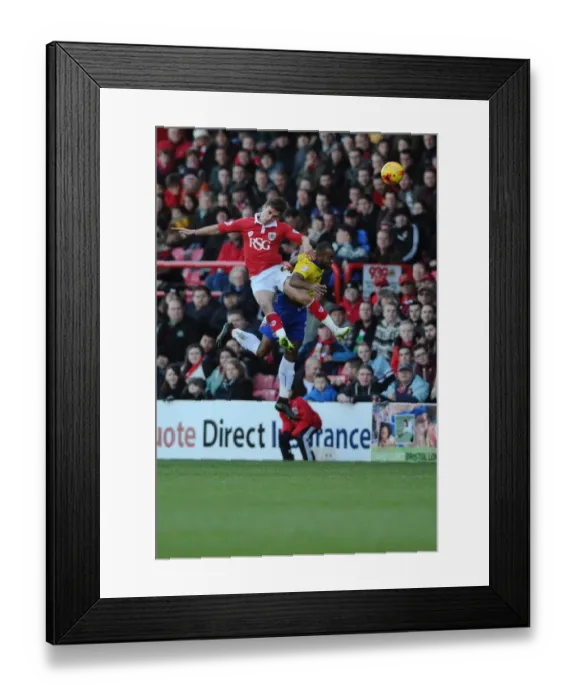 Framed Print : Battling for Supremacy: Joe Bryan's Aerial Clash in Bristol City vs Crawley Town