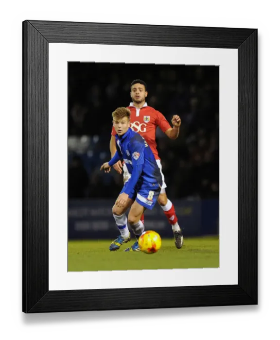 Framed Print : Bristol City vs Gillingham: Derrick Williams Fends Off Jake Hessenthaler's Pressure on the Pitch Framed Print : Bristol City vs Gillingham: Derrick Williams Fends Off Jake Hessenthaler's Pressure on the Pitch