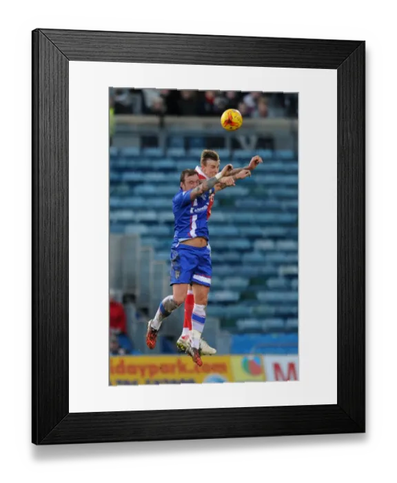 Framed Print : Aden Flint vs. Danny Kedwell: Intense Header Battle at Priestfield Stadium, Bristol City vs. Gillingham, Sky Bet League One Framed Print : Aden Flint vs. Danny Kedwell: Intense Header Battle at Priestfield Stadium, Bristol City vs. Gillingham, Sky Bet League One