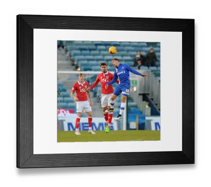 Framed Print : Maron Pack vs. Cody McDonald: Intense Header Battle in Bristol City vs. Gillingham Football Match, December 2014