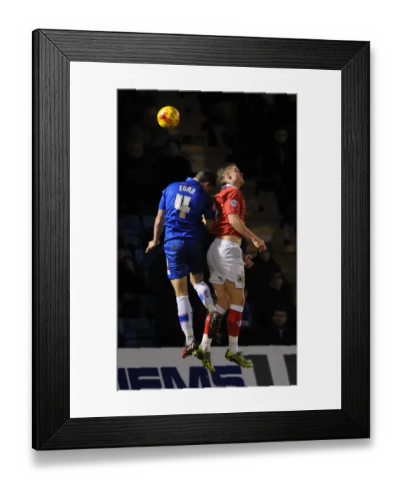 Framed Print : Intense Header Clash: Smith vs Egan, January 6, 2015 - Football Rivalry at Priestfield Stadium