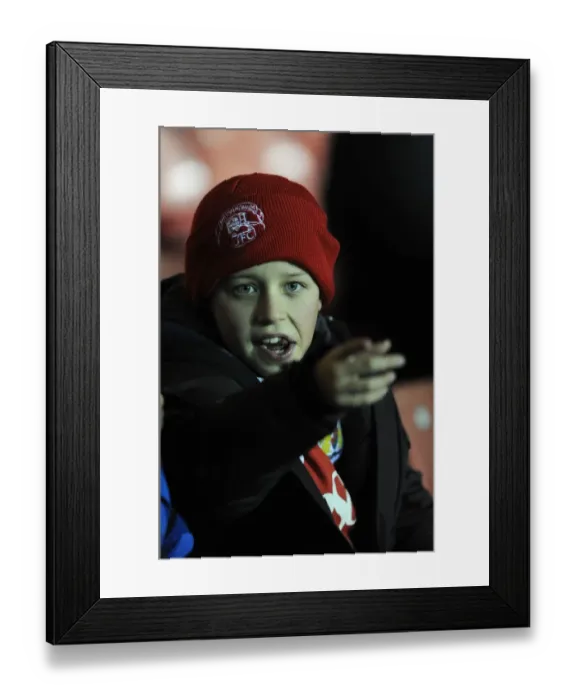 Framed Print : Passionate Bristol City Fan Cheers at Ashton Gate Stadium during FA Cup Third Round Replay Framed Print : Passionate Bristol City Fan Cheers at Ashton Gate Stadium during FA Cup Third Round Replay