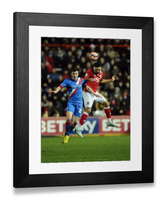 Framed Print : Intense Aerial Clash: Derrick Williams vs. Harry Middleton at Ashton Gate