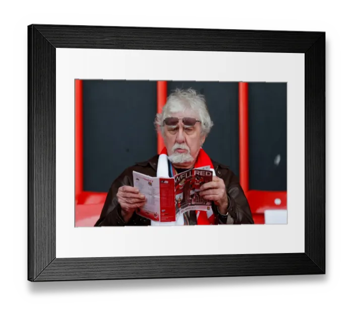Framed Print : Bristol City Fan Peruses Match Program Before FA Cup Encounter vs. West Ham United Framed Print : Bristol City Fan Peruses Match Program Before FA Cup Encounter vs. West Ham United