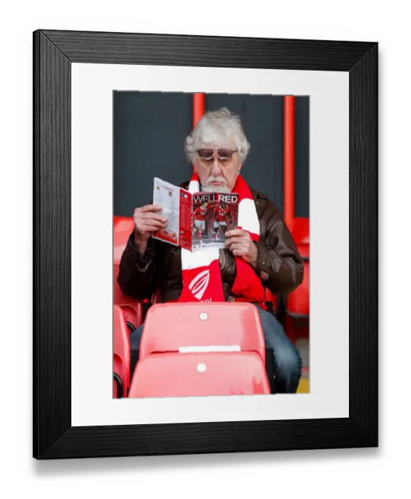 Framed Print : Bristol City Fan Perusing Match Program Before FA Cup Encounter vs. West Ham United, 2015 Framed Print : Bristol City Fan Perusing Match Program Before FA Cup Encounter vs. West Ham United, 2015