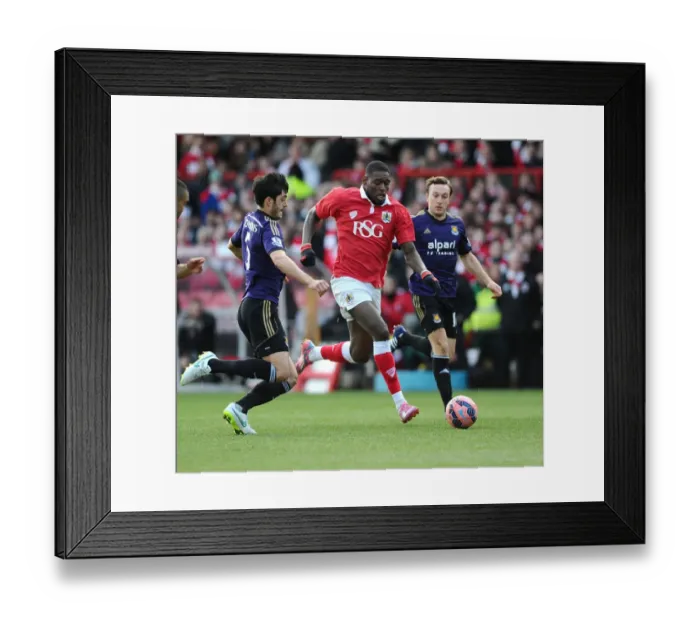 Framed Print : Bristol City's Jay Emmanuel-Thomas Foul by West Ham's James Tomkins during FA Cup Match Framed Print : Bristol City's Jay Emmanuel-Thomas Foul by West Ham's James Tomkins during FA Cup Match