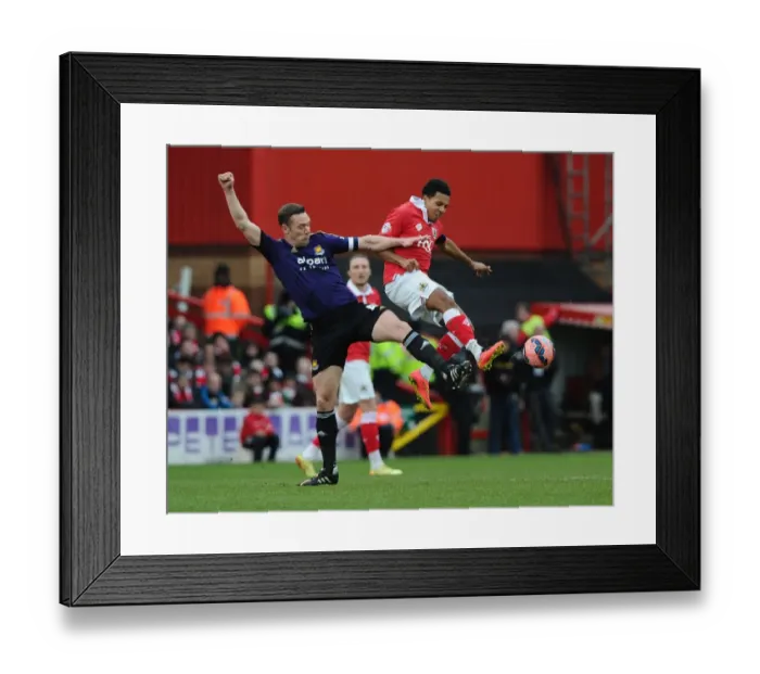 Framed Print : Bristol City vs. West Ham United: Korey Smith vs. Kevin Nolan - Intense Battle on the Pitch
