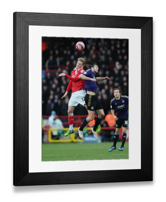 Framed Print : Battling for Supremacy: George Saville vs. Andy Carroll in the FA Cup Fourth Round Clash between Bristol City and West Ham United