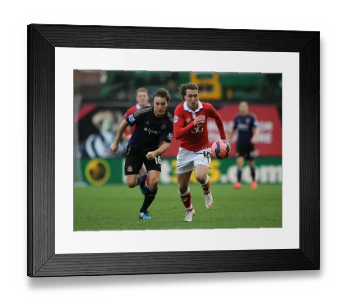 Framed Print : Bristol City's Luke Freeman Chased Down by Mark Noble during FA Cup Fourth Round Clash vs West Ham United Framed Print : Bristol City's Luke Freeman Chased Down by Mark Noble during FA Cup Fourth Round Clash vs West Ham United