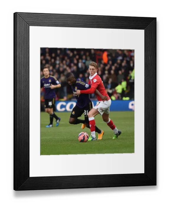 Framed Print : Bristol Citys George Saville tussles with West Hams Enner Valencia in the FA Cup Framed Print : Bristol Citys George Saville tussles with West Hams Enner Valencia in the FA Cup