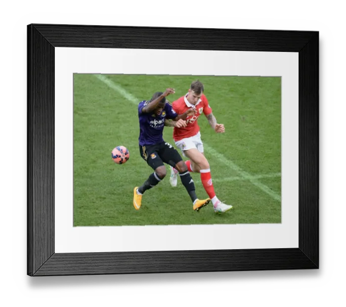 Framed Print : Valencia Steals the Ball from Flint in Intense Bristol City vs West Ham United FA Cup Clash