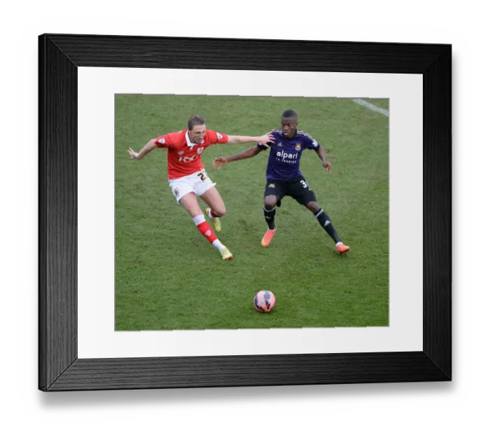 Framed Print : Intense Moment: Luke Ayling and Enner Valencia Battle for Possession during Bristol City vs. West Ham United, FA Cup Fourth Round Framed Print : Intense Moment: Luke Ayling and Enner Valencia Battle for Possession during Bristol City vs. West Ham United, FA Cup Fourth Round