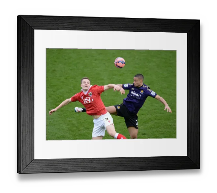 Framed Print : Bristol City's Matt Smith Battles for High Ball Against West Ham's Winston Reid during FA Cup Fourth Round Framed Print : Bristol City's Matt Smith Battles for High Ball Against West Ham's Winston Reid during FA Cup Fourth Round