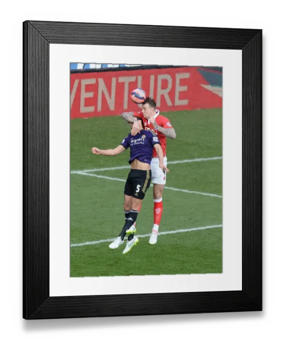 Framed Print : Bristol City's Aden Flint Outjumps West Ham's James Tomkins for a Powerful Aerial Battle