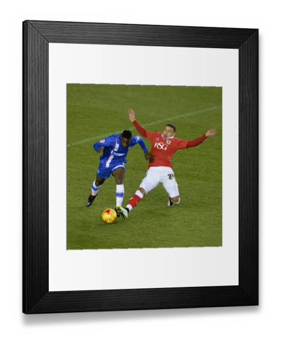 Framed Print : Bristol City vs Gillingham: Tense Moment as James Tavernier Tackles Jermaine McGlashan