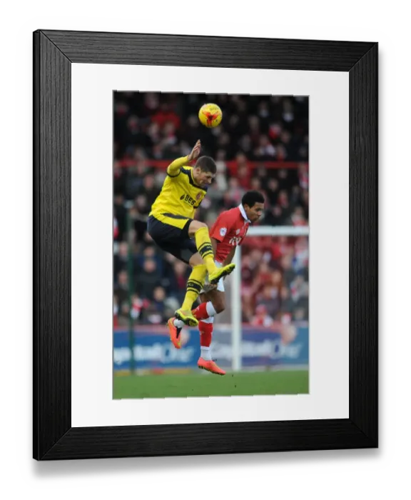 Framed Print : Intense Moment: Korey Smith vs. Jamie Proctor Head-to-Head Clash during Bristol City vs. Fleetwood Town, Sky Bet League One (January 2015)