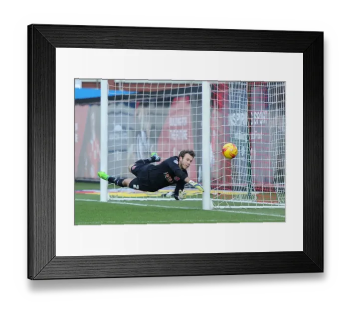 Framed Print : Diving for the Win: Intense Moment at Ashton Gate as Fleetwood Town's Chris Maxwell Reaches for the Ball in Bristol City vs Fleetwood Town Football Match, Sky Bet League One (January 2015) Framed Print : Diving for the Win: Intense Moment at Ashton Gate as Fleetwood Town's Chris Maxwell Reaches for the Ball in Bristol City vs Fleetwood Town Football Match, Sky Bet League One (January 2015)