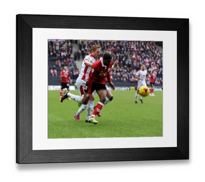 Framed Print : Battling for Supremacy: Mark Little vs. Dean Lewington in MK Dons vs. Bristol City Football Clash