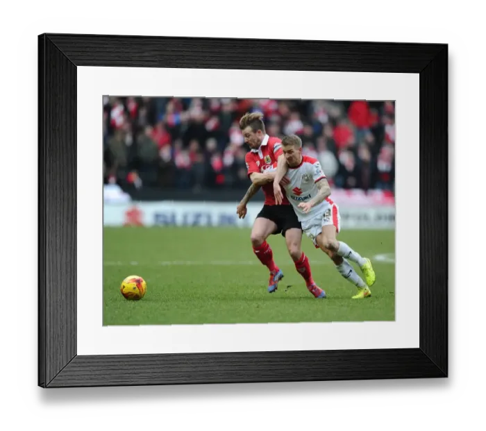 Framed Print : Battling for Supremacy: Wade Elliott vs. Carl Baker in MK Dons vs. Bristol City Football Clash