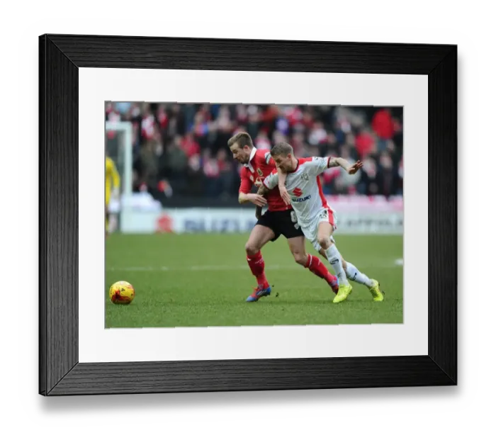 Framed Print : Wade Elliott vs. Carl Baker: Intense Battle for Ball Possession in MK Dons vs. Bristol City Football Match, February 2015