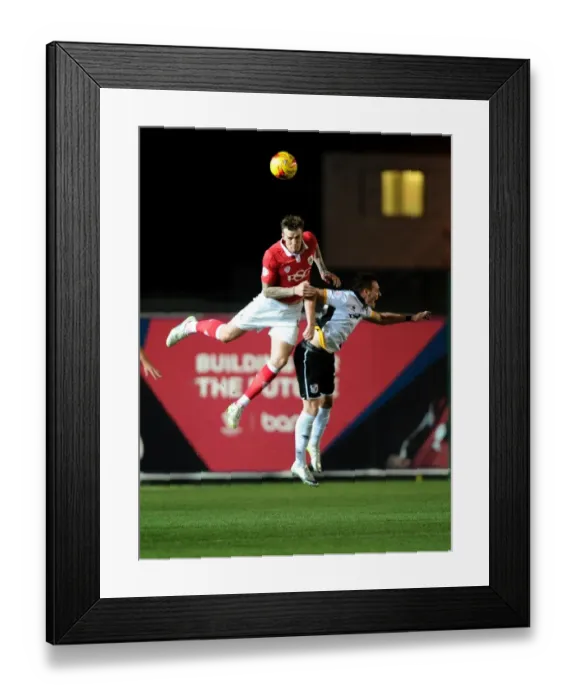 Framed Print : Aden Flint Fights for Supremacy: Bristol City vs Port Vale, Sky Bet League One Framed Print : Aden Flint Fights for Supremacy: Bristol City vs Port Vale, Sky Bet League One