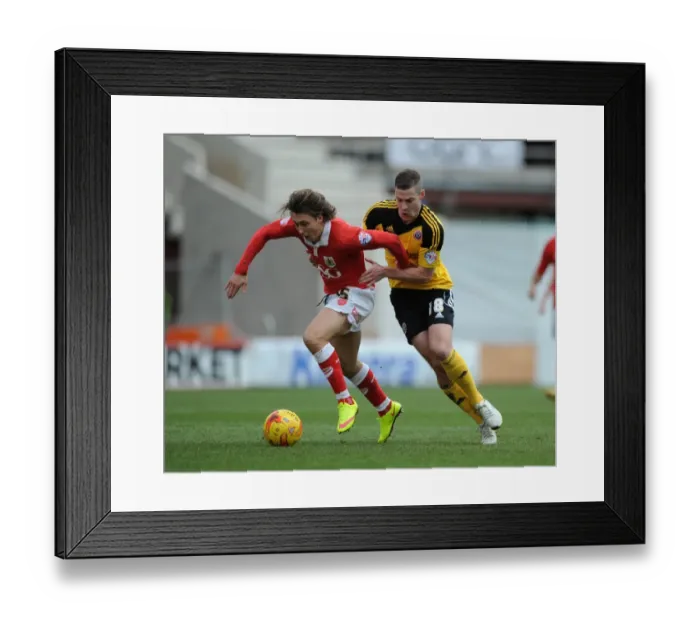 Framed Print : Intense Moment: Paul Coutts Fouls Luke Freeman in Sky Bet League One Clash Framed Print : Intense Moment: Paul Coutts Fouls Luke Freeman in Sky Bet League One Clash