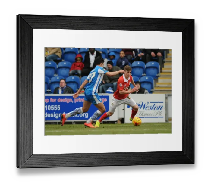 Framed Print : Bristol City's Joe Bryan Outmaneuvers Colchester United's Macauley Bonne During Sky Bet League One Clash Framed Print : Bristol City's Joe Bryan Outmaneuvers Colchester United's Macauley Bonne During Sky Bet League One Clash