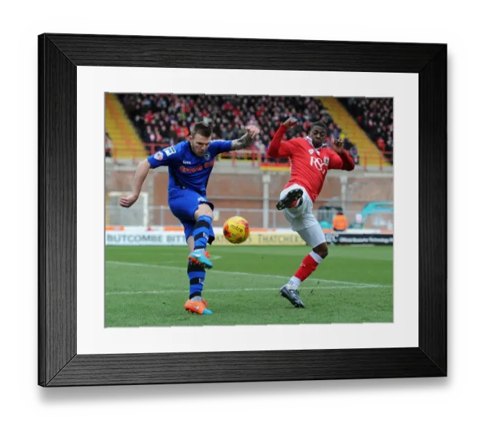Framed Print : Bristol City's Kieran Agard Closes In on Rochdale's Ashley Eastham in Intense Football Action Framed Print : Bristol City's Kieran Agard Closes In on Rochdale's Ashley Eastham in Intense Football Action