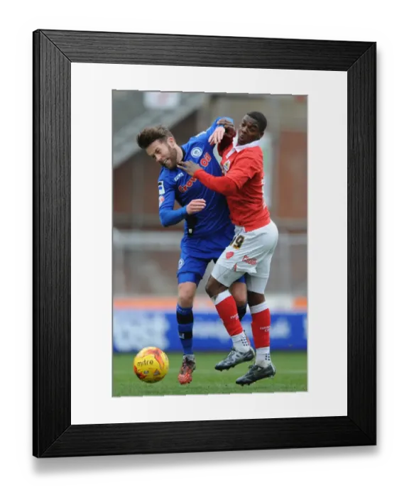 Framed Print : Bristol City vs Rochdale: Intense Battle for Possession between Kieran Agard and Thomas Kennedy