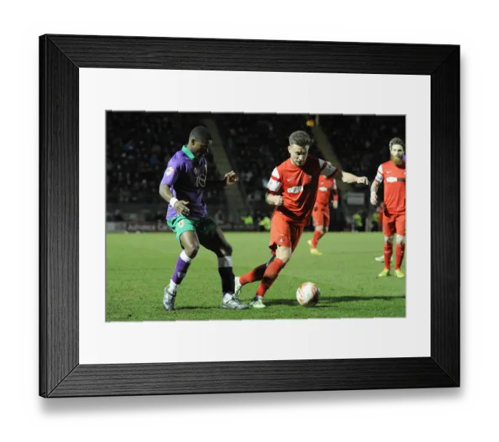 Framed Print : Leyton Orient's Luke O'Neil Evades Kieran Agard in Thrilling Sky Bet League One Clash Framed Print : Leyton Orient's Luke O'Neil Evades Kieran Agard in Thrilling Sky Bet League One Clash