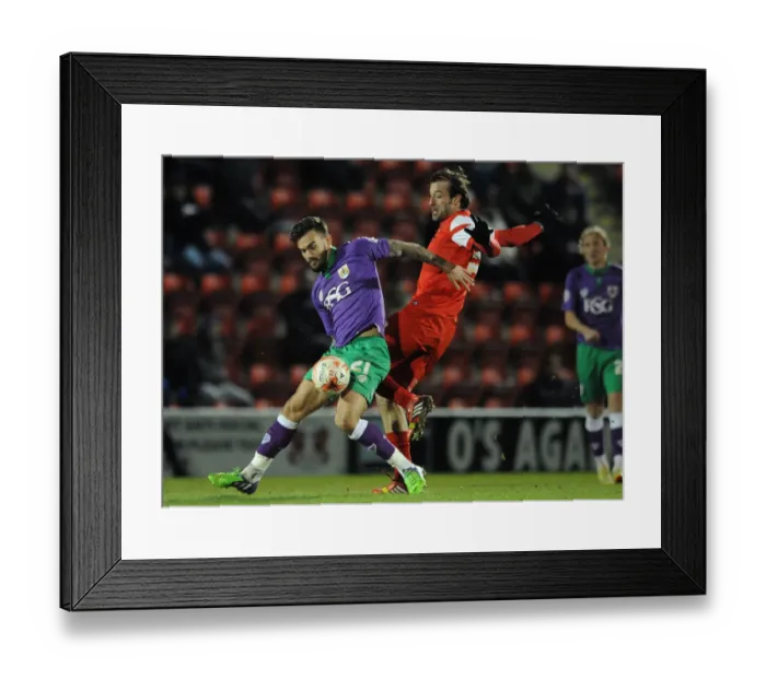Framed Print : Maron Pack vs. Gianvito Plasmati: A Battle for Control in the Sky Bet League One Clash between Leyton Orient and Bristol City, March 2015