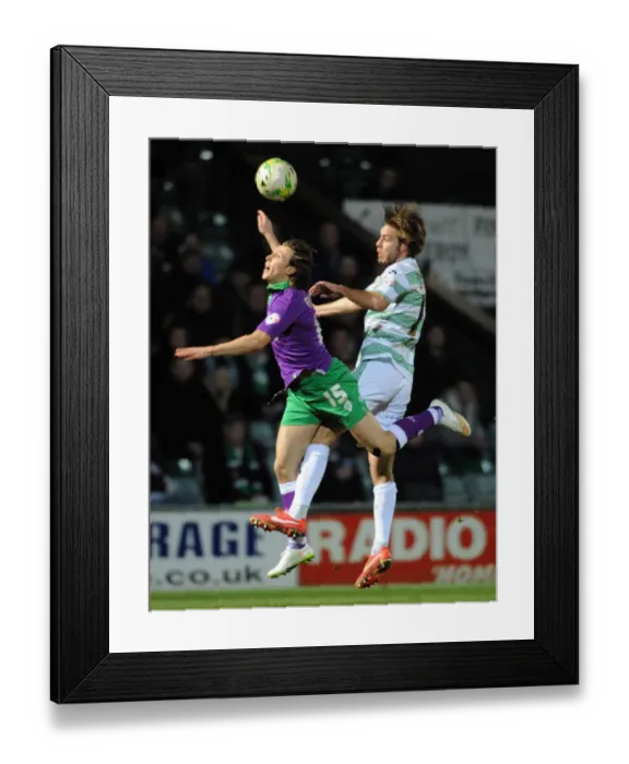 Framed Print : Clash at Huish Park: Luke Freeman vs. Sam Foley in Sky Bet League One Showdown Framed Print : Clash at Huish Park: Luke Freeman vs. Sam Foley in Sky Bet League One Showdown