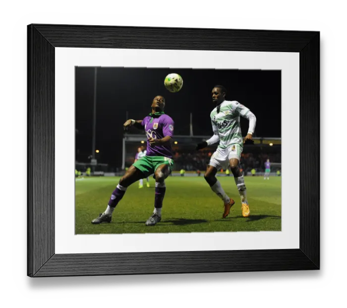 Framed Print : Bristol City's Kieran Agard Closes In on Yeovil Town's Nathan Smith in Sky Bet League One Clash Framed Print : Bristol City's Kieran Agard Closes In on Yeovil Town's Nathan Smith in Sky Bet League One Clash