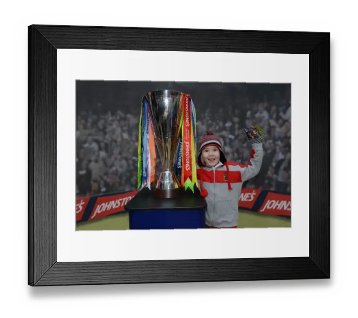 Framed Print : Young Fan Celebrates with JPT Trophy at Cabot Circus