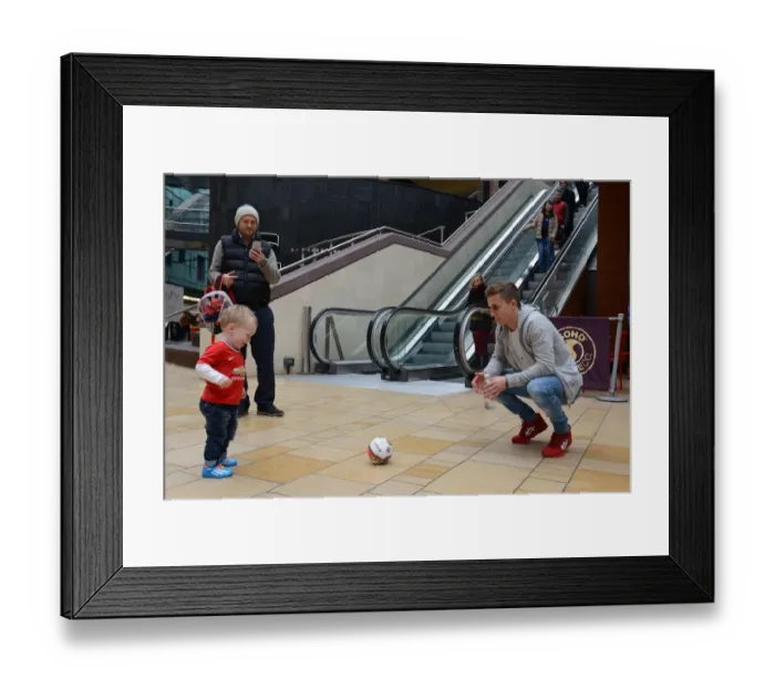 Framed Print : Bristol City Footballer Joe Bryan Plays with Young Fan at Cabot Circus during Johnstones Paint Trophy Match Framed Print : Bristol City Footballer Joe Bryan Plays with Young Fan at Cabot Circus during Johnstones Paint Trophy Match