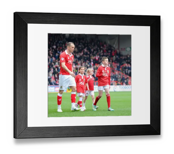 Framed Print : Bristol City Football Club: Mascots Accompany Aaron Wilbraham onto Ashton Gate Pitch vs Gillingham (140315)