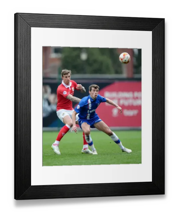 Framed Print : Intense Rivalry: Aden Flint vs John Marquis in the Heart of the Bristol City vs Gillingham Clash