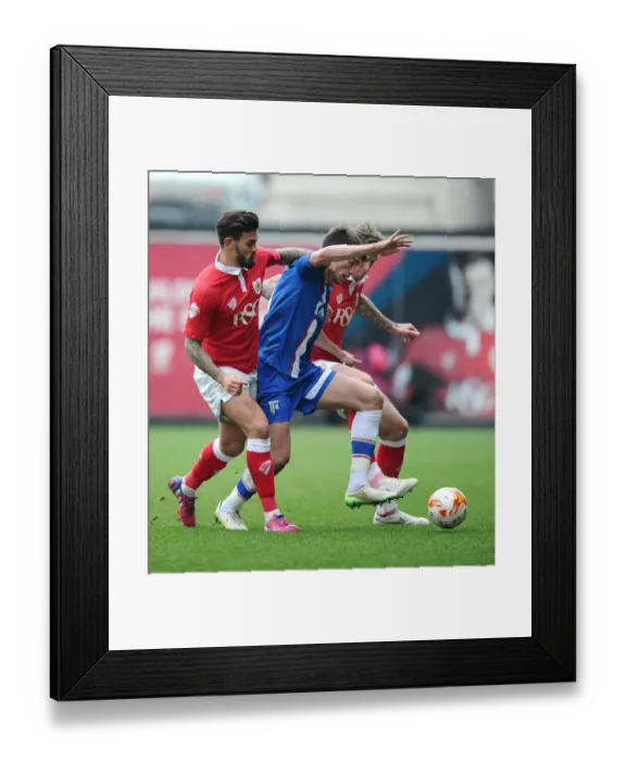 Framed Print : Intense Rivalry: Aden Flint and Marlon Pack of Bristol City Clash with John Marquis of Gillingham Framed Print : Intense Rivalry: Aden Flint and Marlon Pack of Bristol City Clash with John Marquis of Gillingham