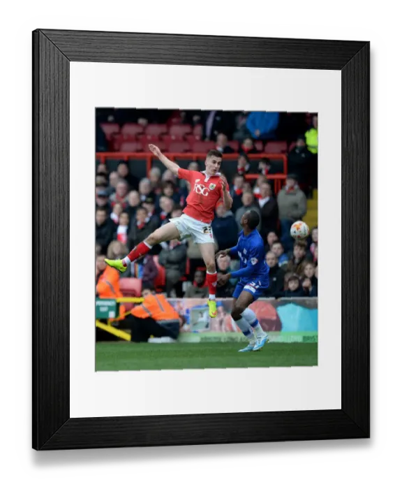 Framed Print : Battling Rivals: Bryan vs. Hoyte - Intense Football Moment at Ashton Gate