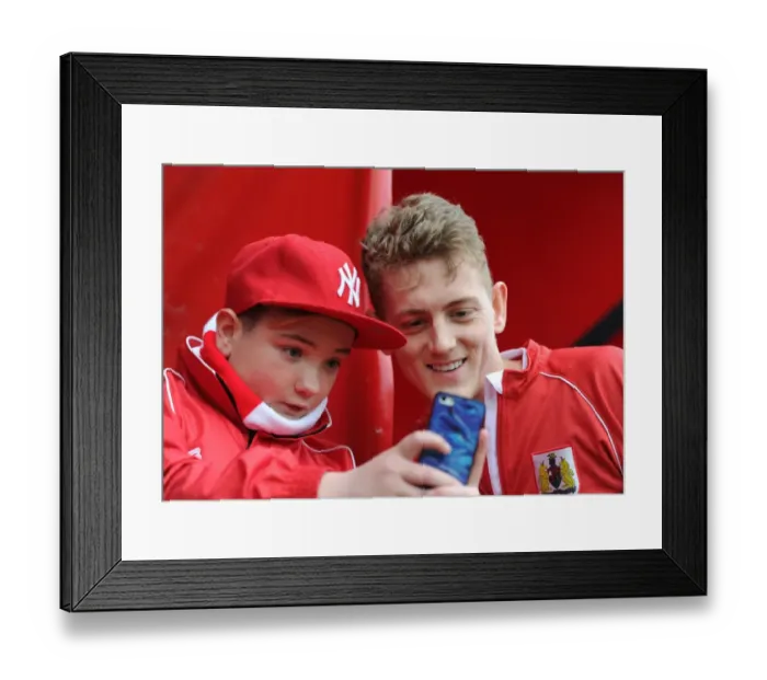 Framed Print : Bristol City's George Saville Engages with Fans during Bristol City vs Barnsley Match, March 2015 Framed Print : Bristol City's George Saville Engages with Fans during Bristol City vs Barnsley Match, March 2015