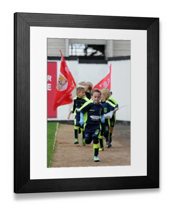 Framed Print : Mascots of Hutton JFC Celebrate Half-Time at Ashton Gate Stadium during Bristol City vs Barnsley Match Framed Print : Mascots of Hutton JFC Celebrate Half-Time at Ashton Gate Stadium during Bristol City vs Barnsley Match