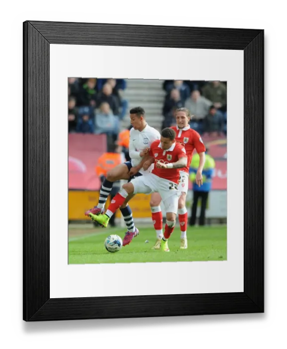 Framed Print : Clash at Deepdale: Preston's Callum Robinson Stops James Tavernier in His Tracks Framed Print : Clash at Deepdale: Preston's Callum Robinson Stops James Tavernier in His Tracks