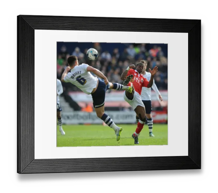 Framed Print : Agard vs. Wright: Intense Battle for the Ball in Preston North End vs. Bristol City