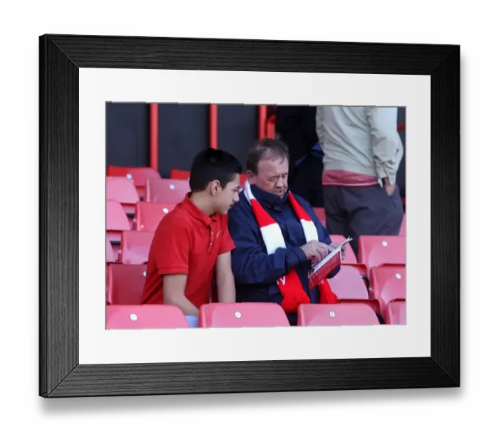 Framed Print : Bristol City Fans Engrossed in Match Day Programme during Bristol City v Coventry City Game, Ashton Gate, 2015 Framed Print : Bristol City Fans Engrossed in Match Day Programme during Bristol City v Coventry City Game, Ashton Gate, 2015