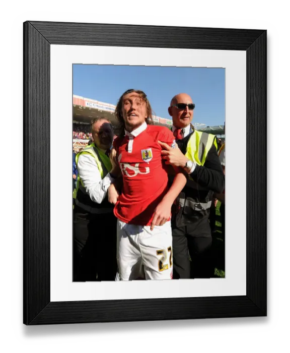 Framed Print : Bristol City's Euphoric Celebrations: Luke Ayling Led Back After Fans Invade Pitch to Secure League One Victory Framed Print : Bristol City's Euphoric Celebrations: Luke Ayling Led Back After Fans Invade Pitch to Secure League One Victory