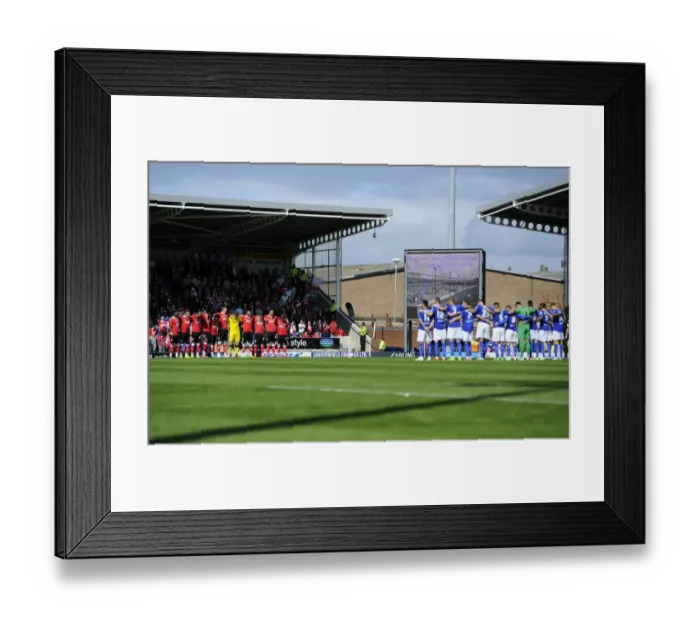 Framed Print : Respectful Moment: Chesterfield vs. Bristol City Footballers Honor a Minute's Silence
