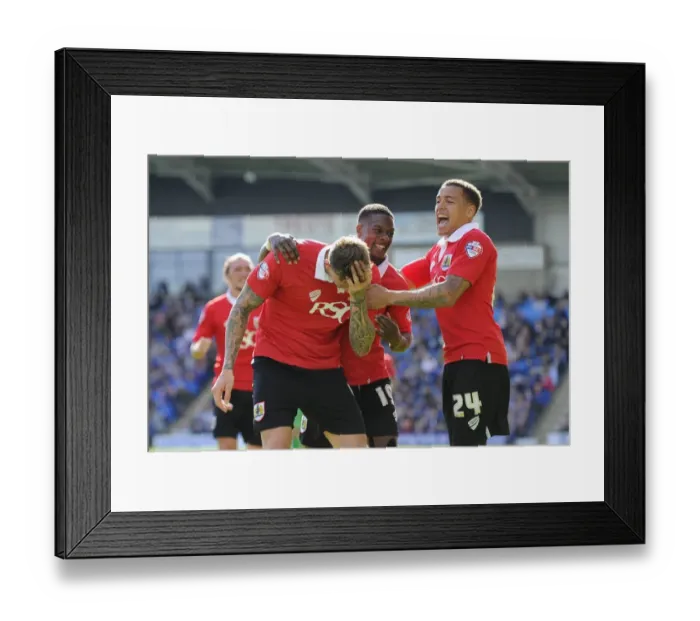 Framed Print : Triumphant Threesome: Aden Flint, Kieran Agard, and James Tavernier Celebrate Winning Goal for Bristol City vs Chesterfield (April 2015)