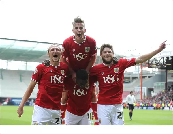 Bristol City's Kieran Agard Celebrates Double Strike with Teammates Luke Ayling, Joe Bryan, and Wes Burns during Bristol City vs Walsall Football Match, May 2015